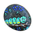 Hand painted caterpillar on a stick on a natural stone rock