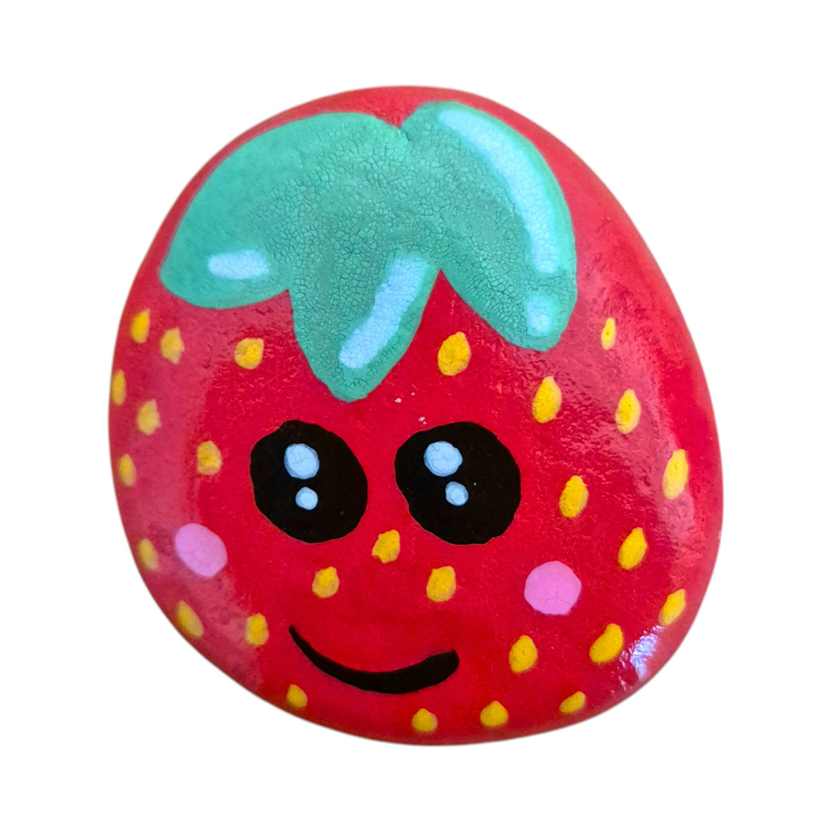 Hand painted smiling red strawberry on a natural stone rock