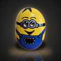 Banana Bandit, a hand painted cheeky yellow character rock with goggles, on a black and gold background