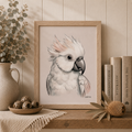 Framed artwork of a cockatoo on a shelf with decorative items.