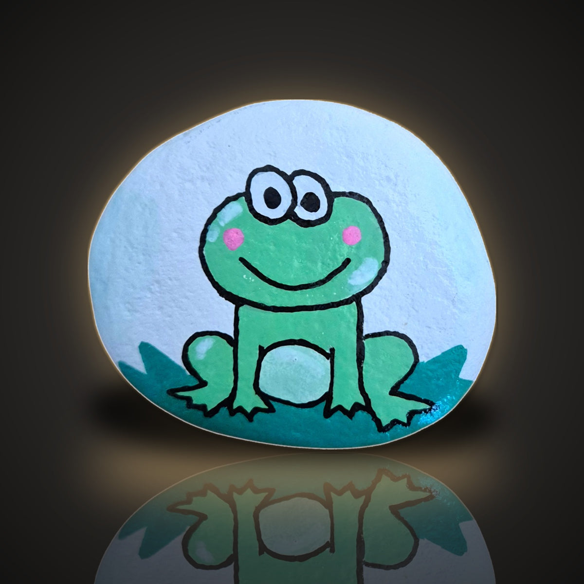 Lily Pad Larry, a hand painted green frog on a leaf rock, on a black and gold background