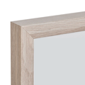 Close-up detail of natural wood picture frame corner, showing grain texture and seamless join.