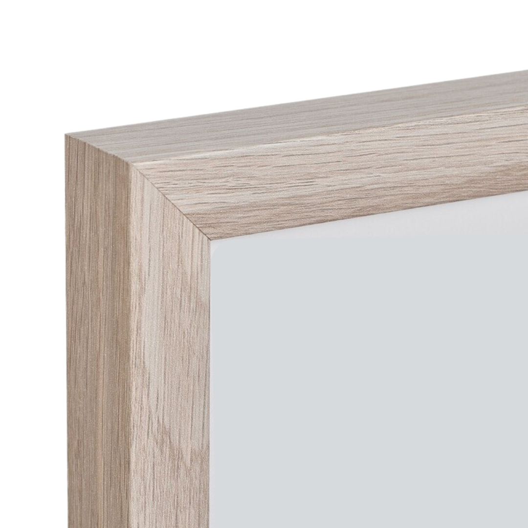 Close-up detail of natural wood picture frame corner, showing grain texture and seamless join.