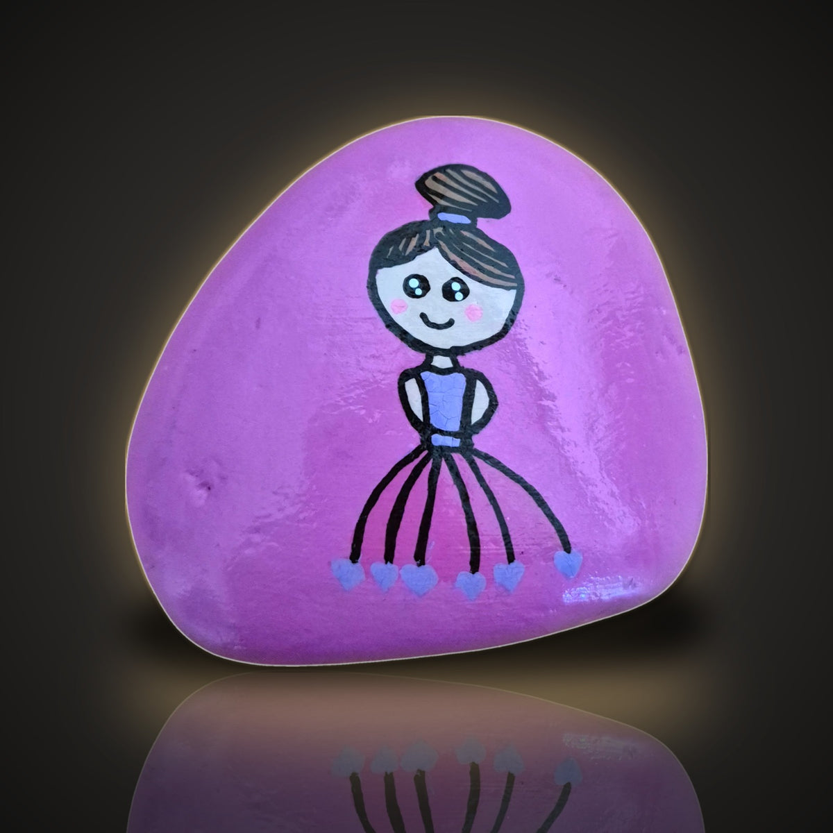 Twirly Tilly, a hand painted pink ballerina rock, on a black and gold background