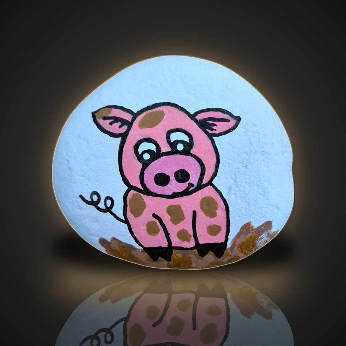 Muddy Mabel, a hand painted pink pig in the mud rock, on a black and gold background