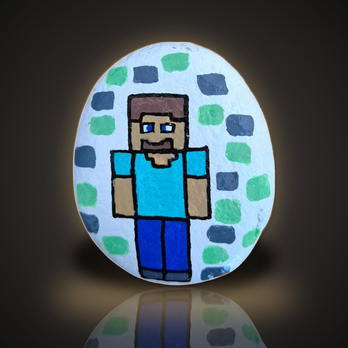 Pixel Pete, a hand painted blocky pixel-style gamer rock, on a black and gold background