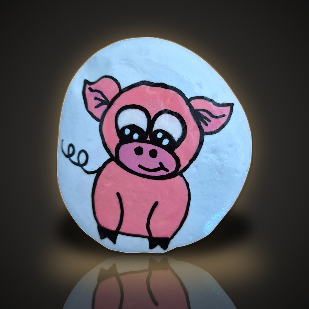 Princess Piglet, a hand painted happy pink pig rock, on a black and gold background