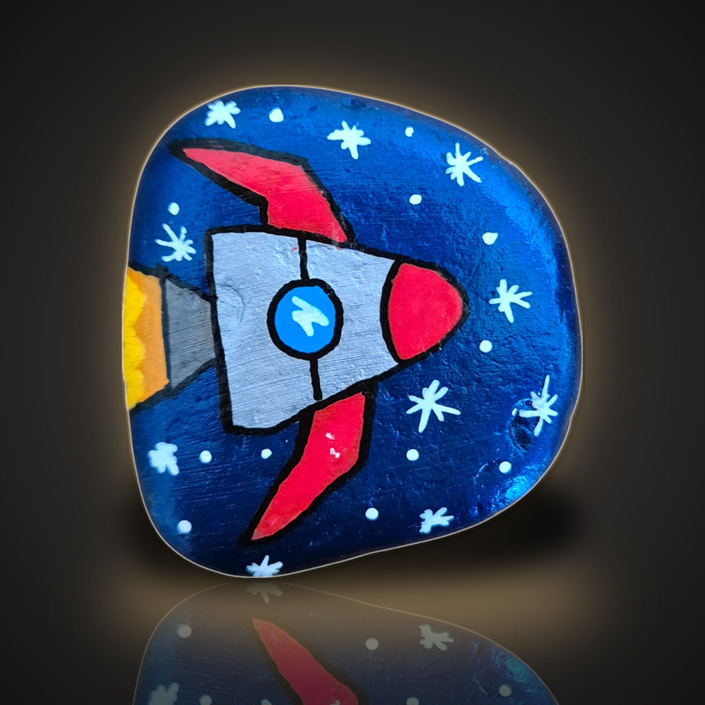 Blast Off Benny, a hand painted rocketship in a starry night sky rock, on a black and gold background
