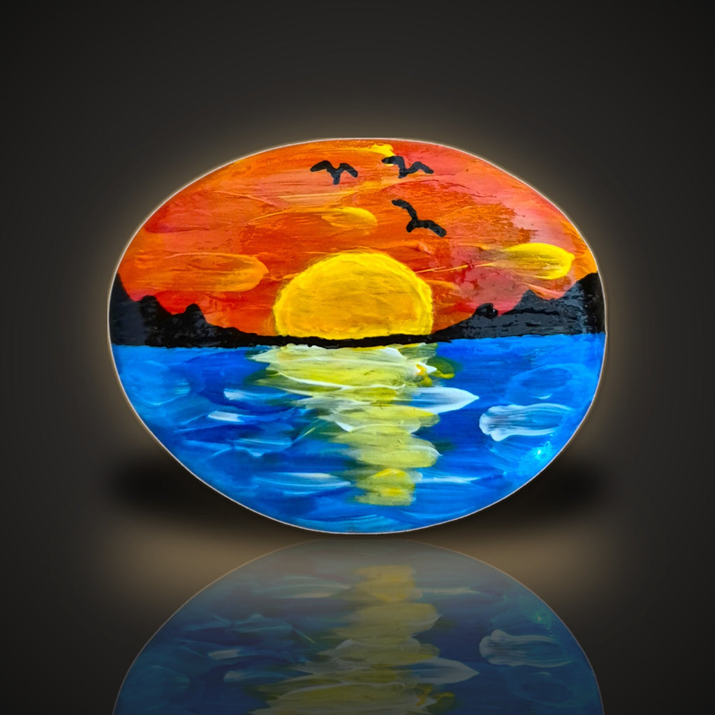 Golden Hour, a hand painted sunset over water rock in raised textured paint, on a black and gold background